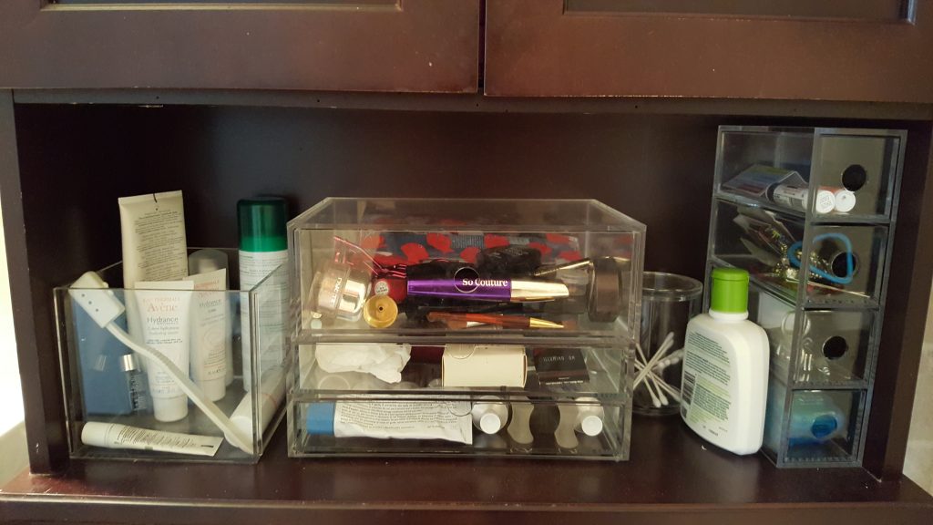 Daily use items are in the box on the left for quick access. Drawers on the right contain lip products, hair products, items for nail care, and dental care. 